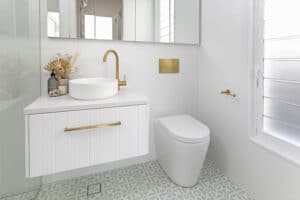 brass in wall toilet cistern coastal bathroom hamptons luxe highgrove bathrooms TileCloud albert park tiles palm beach sage green encaustic look