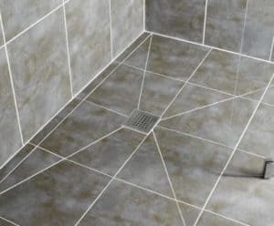 Central shower drain tiling grout lines