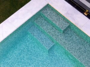 Concrete Pool features mosaic internal steps